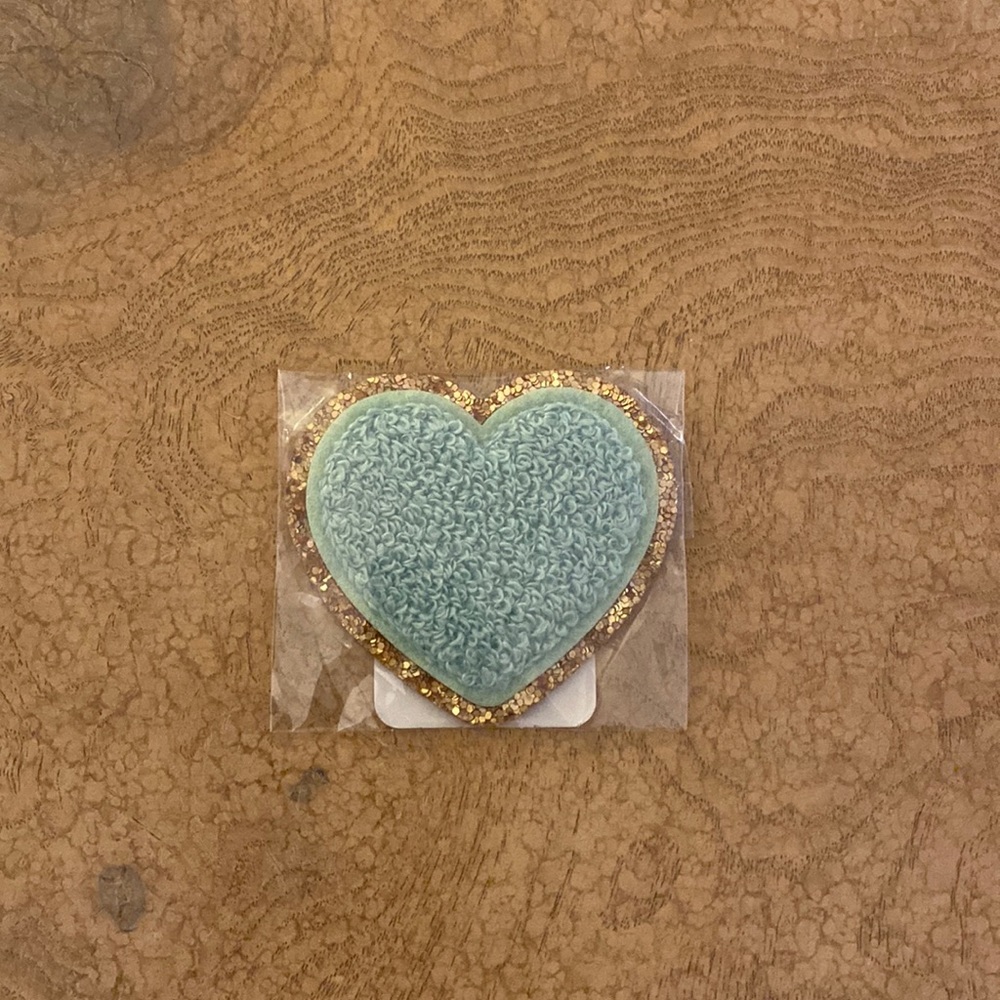 Never opened pistacio colored varsity heart from Stoney Clover Lane. Brand new